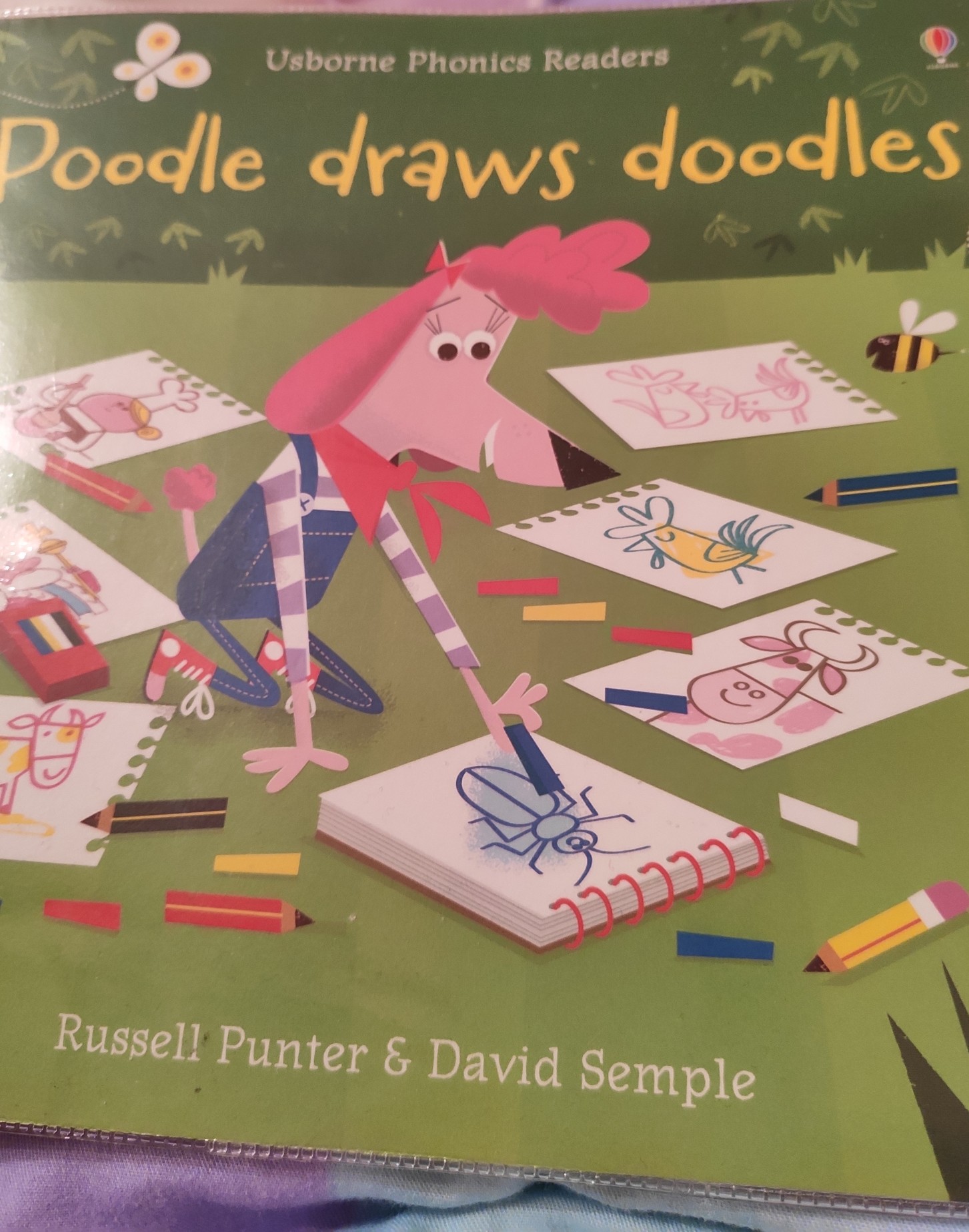 Poodle draws doodles