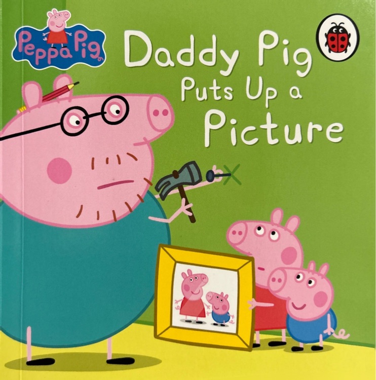 daddy pig puts up a picture