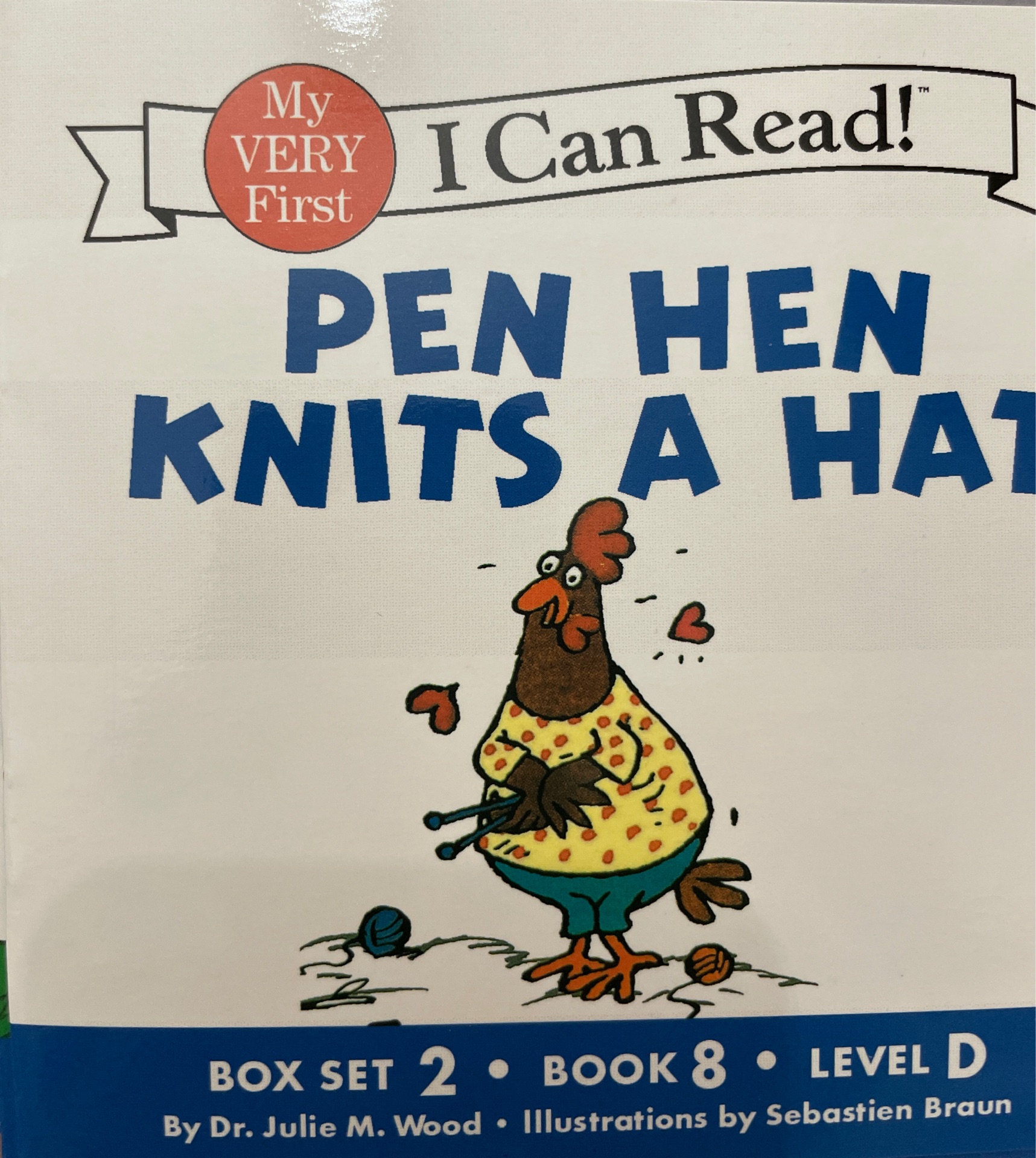 pen hen knits a hat