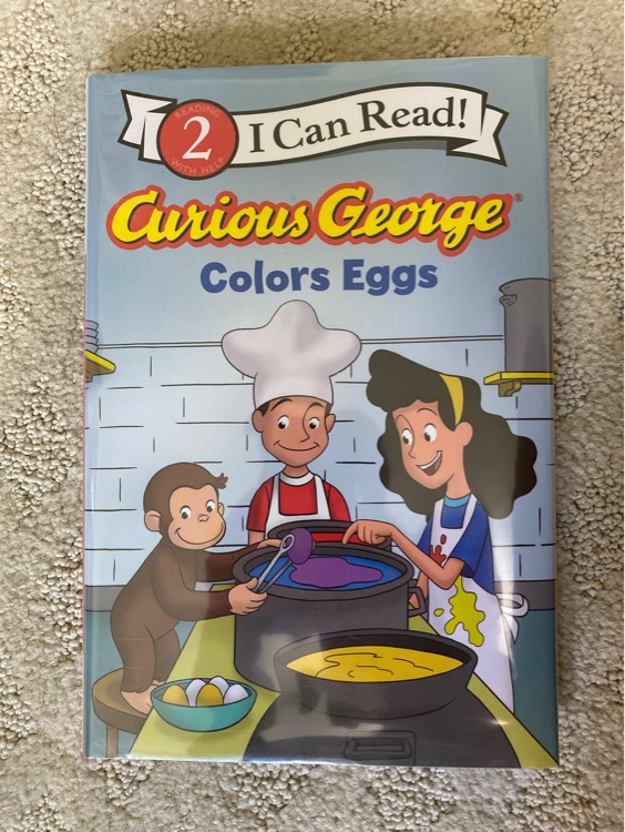 Curious George colors eggs