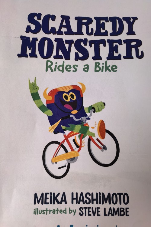 scaredy monster rides a bike