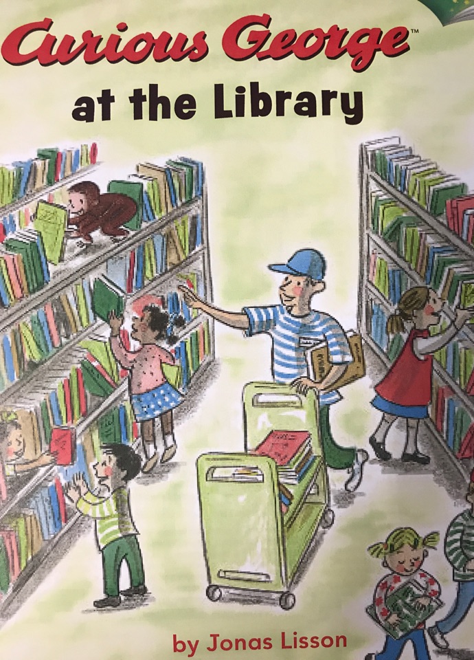 Curious George at the library