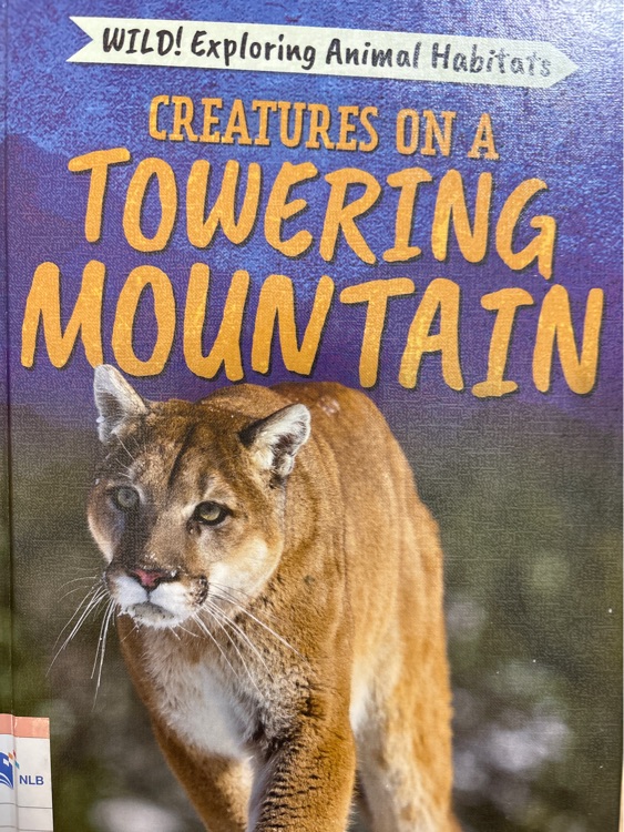 creatures on a towering mountain